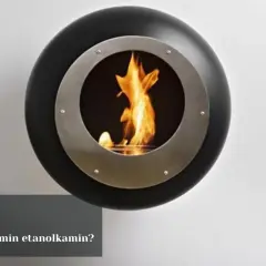 En modern, rund etanol bränsle kamin med flammor som lyser upp rummet. En guide visar hur du startar din etanolkamin.