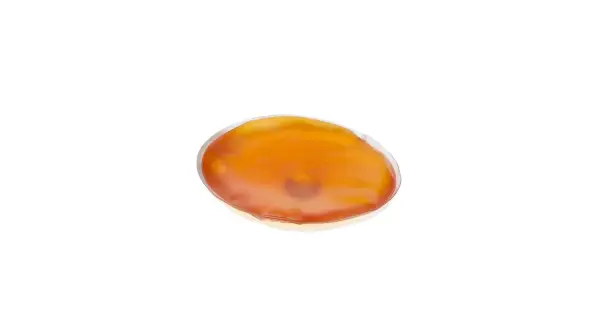 En oval, orange handvärmare som ser ut att vara redo att koka.