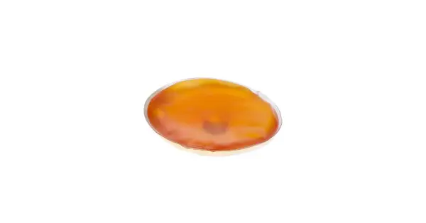 En oval, orange handvärmare som ser ut att vara redo att koka.
